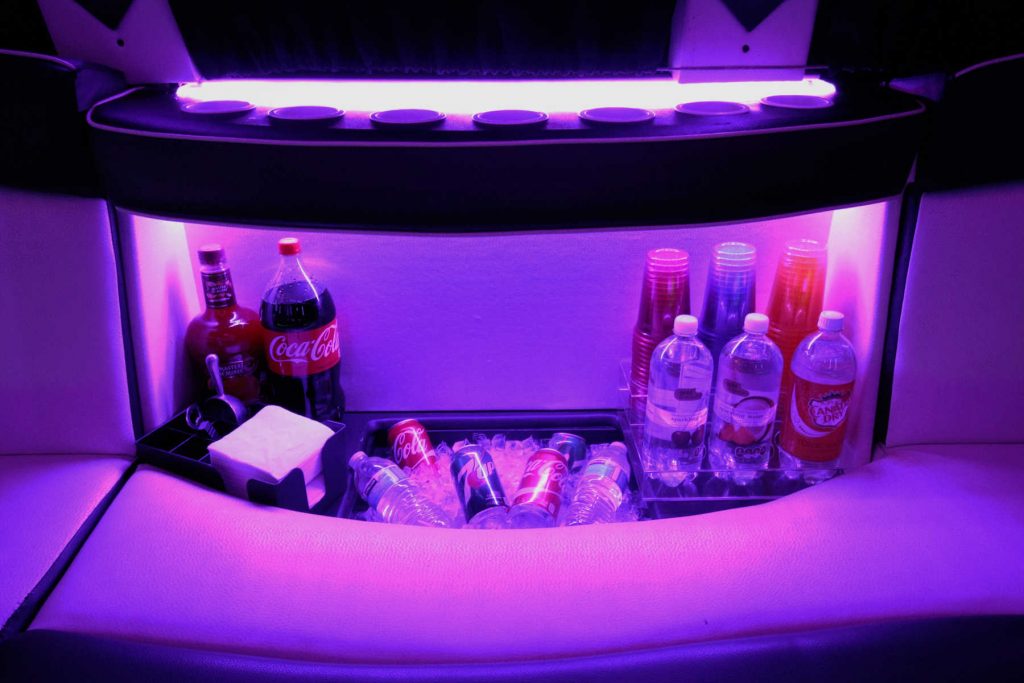 party bus mini bar, stocked with soda, other mixers, and cups