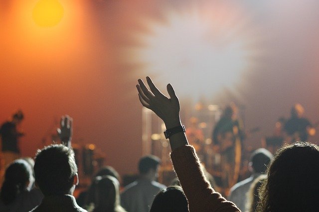 Audience with their hands up at a concert